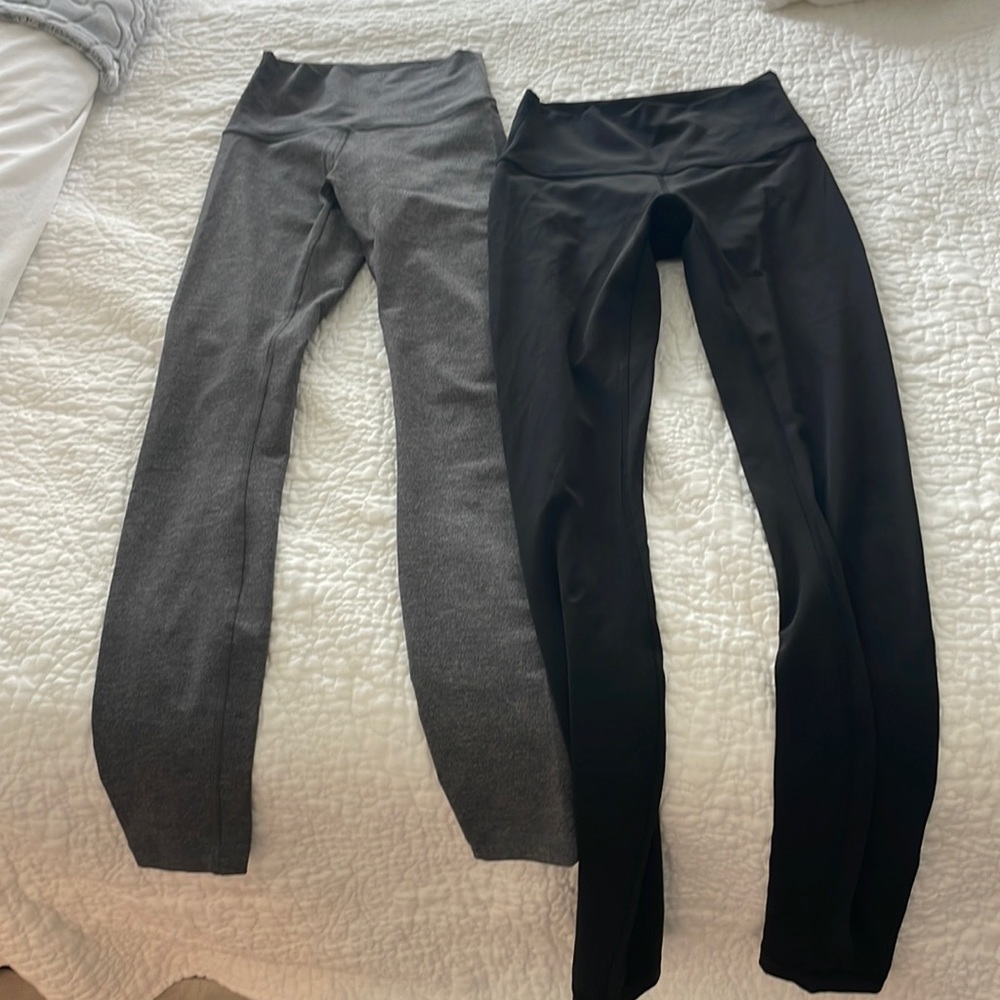 Two pairs of lulu leggings, grey and black, size 2